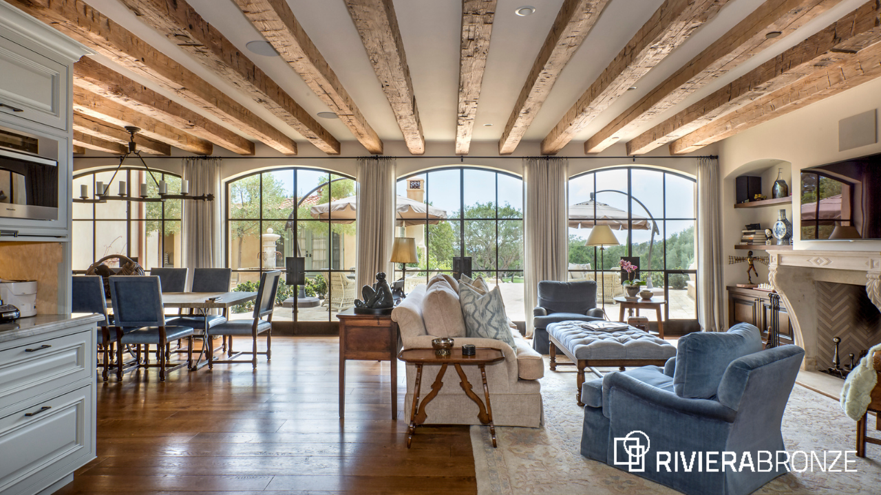 Riviera Bronze Arched Steel Windows in Luxury Living Room Luxury living room with custom Riviera Bronze arched steel windows showcasing natural light, handcrafted detailing, and indoor outdoor architectural design.